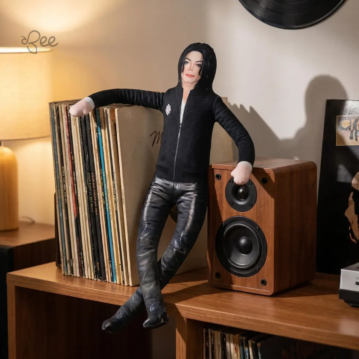 Michael Jackson Iconic Eras Funny Collectible Plush Dolls Toy Gift 12 Close up of an MJ-inspired plush doll leaning against a stack of vinyl records.