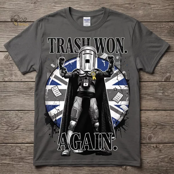 A flat lay of a charcoal grey crew neck t-shirt displaying a satirical illustration of Count Binface with the text Trash Won Again.